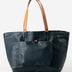 Dark blue tote bag with brown handles on a white background